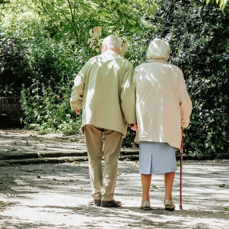An elderly couple walking